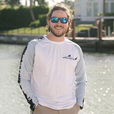 Young man wearing Anglers Tide white long sleeve fishing shirt