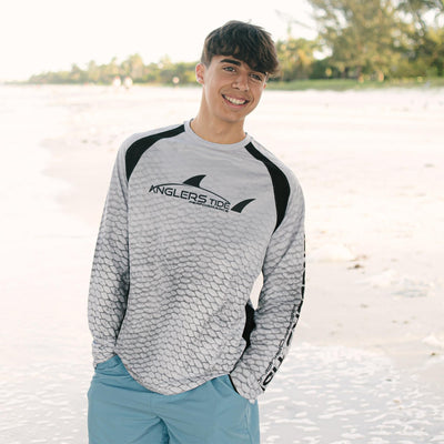 Young man at the beach#color_plato-light-grey