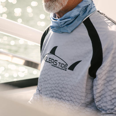 Man wearing Anglers Tide fishing shirt#color_plato-light-grey